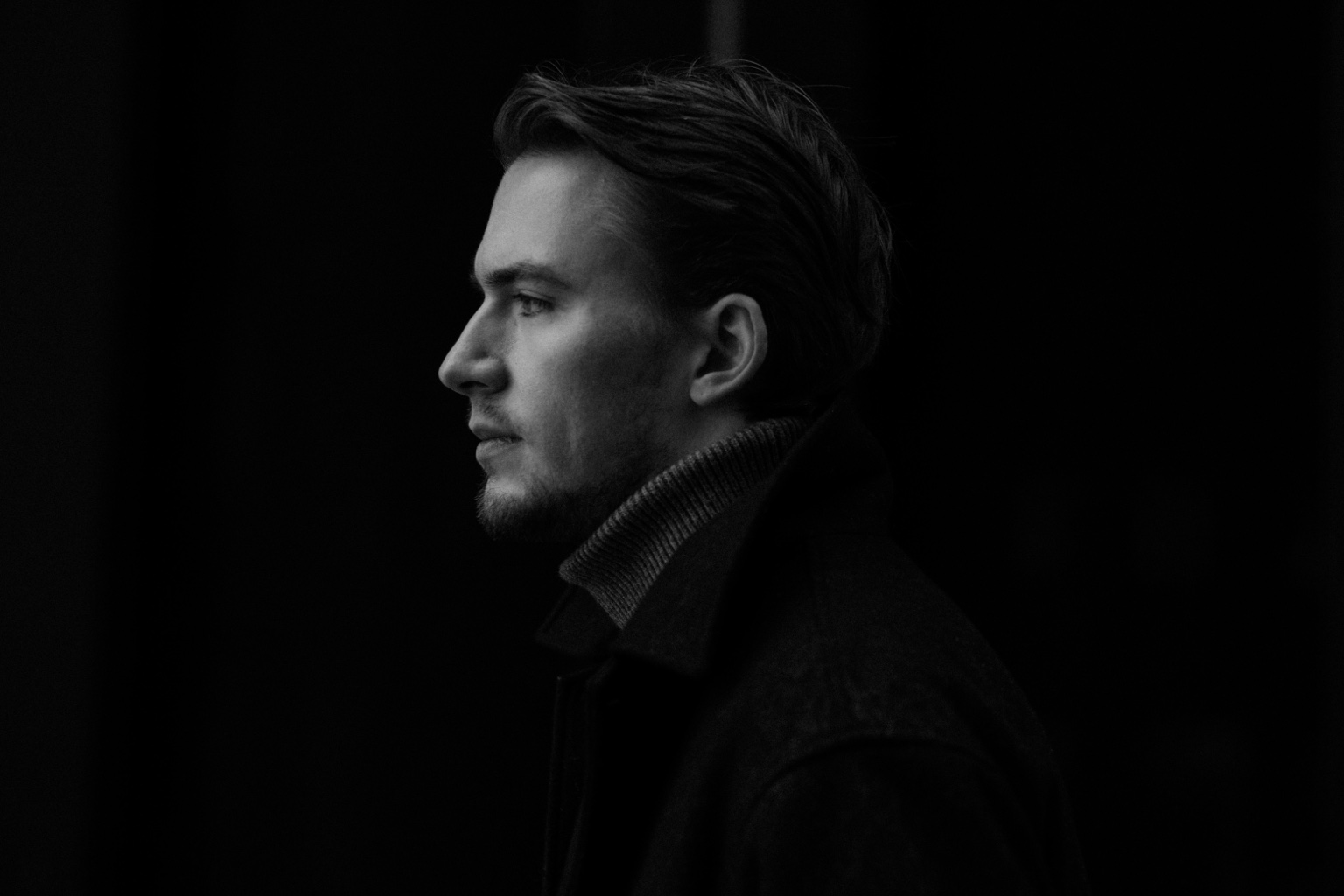Black and white side-profile men’s fashion portrait